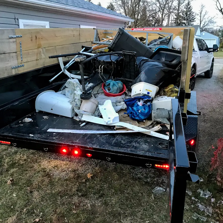 Roll-off dumpster delivered to a residential driveway in Sleepy Eye